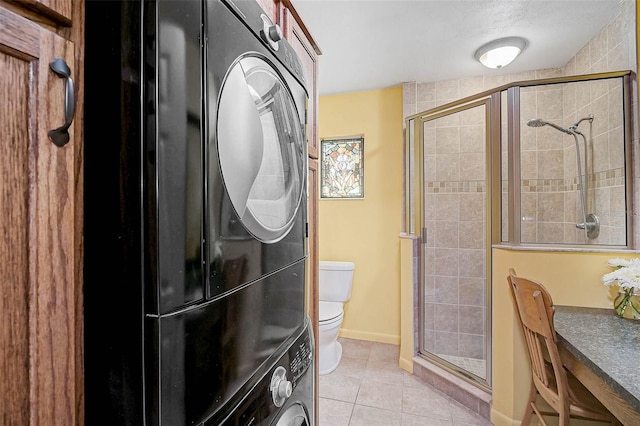 2708 27th Avenue Dr W, Bradenton, FL 34205 - full bathroom with a shower stall, tile patterned flooring, and estacked washer and dryer