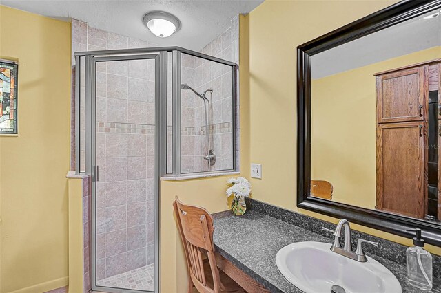 2708 27th Avenue Dr W, Bradenton, FL 34205 - full bathroom with a shower stall, vanity, and a textured ceiling