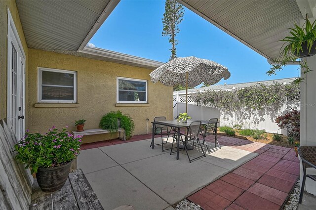 2708 27th Avenue Dr W, Bradenton, FL 34205 - fenced backyard with a patio area and outdoor dining area