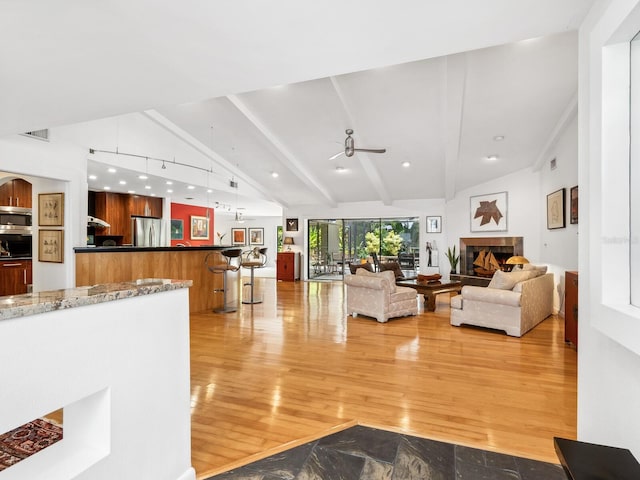 3905 Country View Dr, Sarasota, FL 34233 - living area with light wood-style floors and a ceiling fan