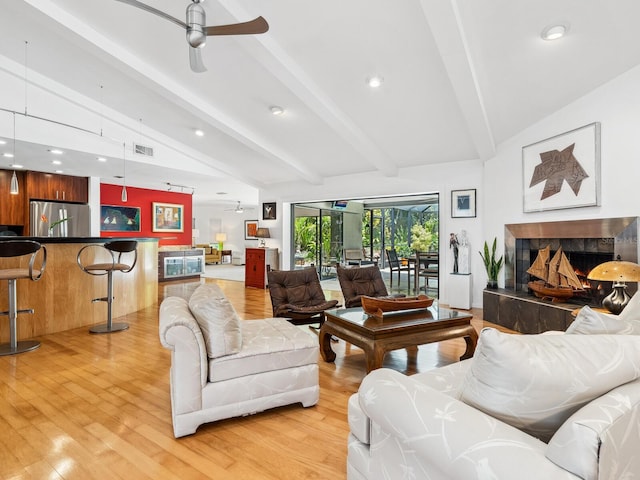 3905 Country View Dr, Sarasota, FL 34233 - living area with ceiling fan, a high end fireplace, light wood-style flooring, and recessed lighting