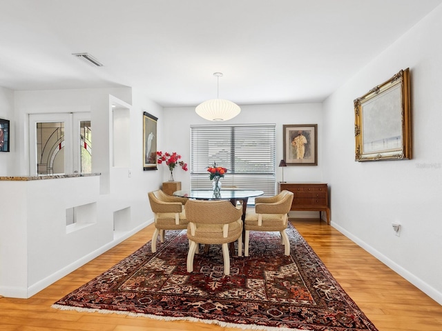 3905 Country View Dr, Sarasota, FL 34233 - dining space with light wood-style flooring and baseboards