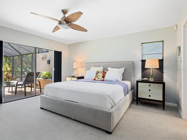 3905 Country View Dr, Sarasota, FL 34233 - bedroom with access to outside, multiple windows, light carpet, and a ceiling fan