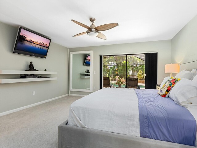 3905 Country View Dr, Sarasota, FL 34233 - carpeted bedroom with access to outside, baseboards, and a ceiling fan