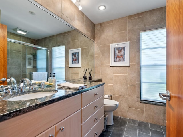 3905 Country View Dr, Sarasota, FL 34233 - bathroom featuring tile walls, vanity, toilet, and a shower with door