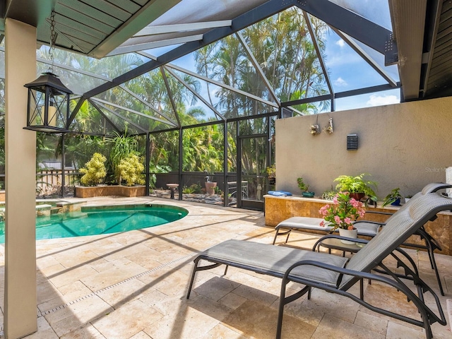 3905 Country View Dr, Sarasota, FL 34233 - view of swimming pool featuring a patio area, glass enclosure, and a pool with connected hot tub