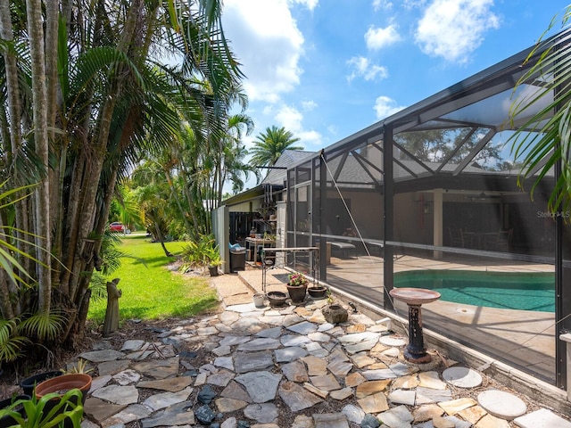 3905 Country View Dr, Sarasota, FL 34233 - outdoor pool featuring a patio area, a lawn, and glass enclosure