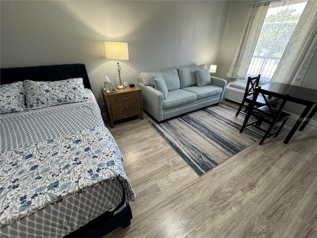 bedroom with light wood finished floors