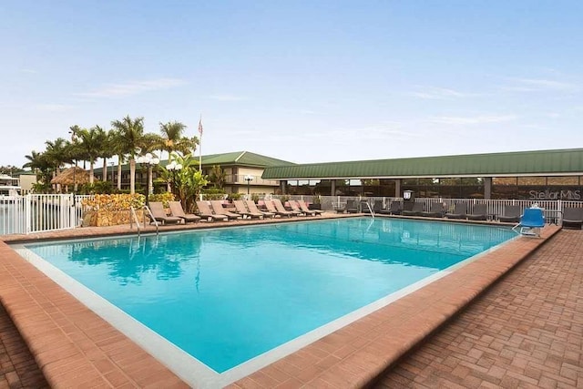 community pool featuring fence