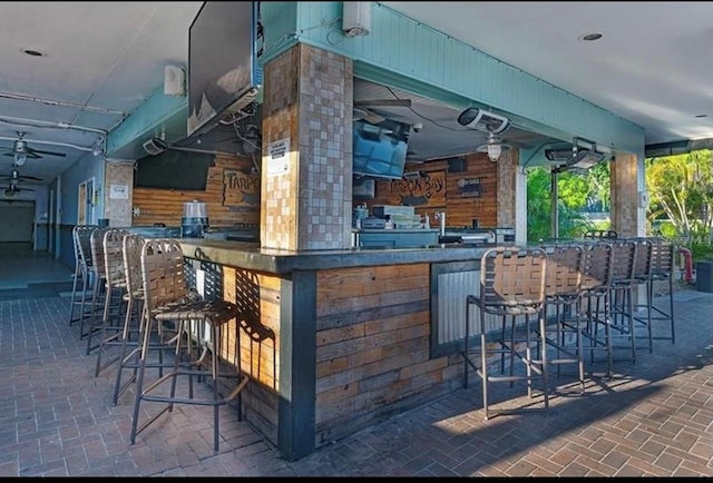 view of patio / terrace featuring ceiling fan
