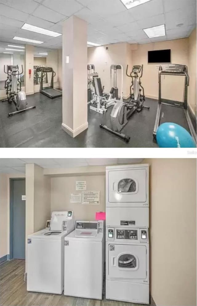 gym featuring a paneled ceiling, estacked washer and dryer, baseboards, and washer and clothes dryer