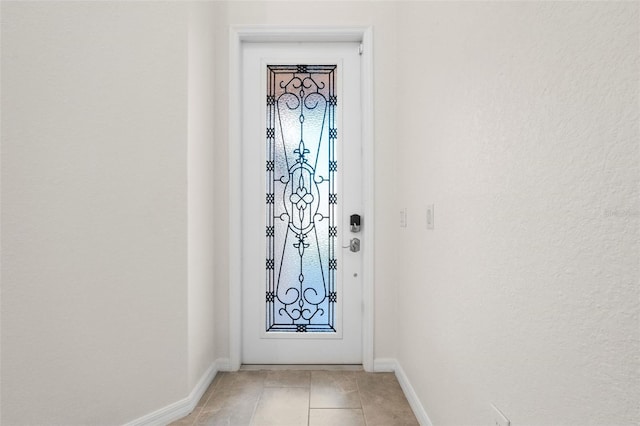 10820 Tarflower Dr Unit 202, Venice, FL 34293 - entryway featuring baseboards and light tile patterned flooring