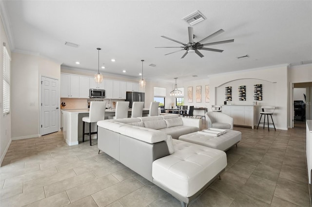 10820 Tarflower Dr Unit 202, Venice, FL 34293 - living area featuring ornamental molding, recessed lighting, ceiling fan, and baseboards