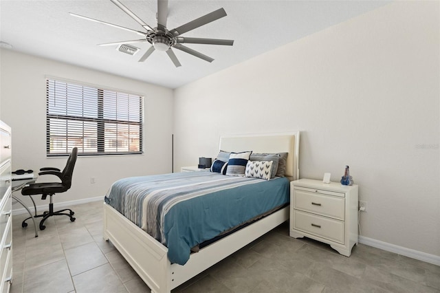 10820 Tarflower Dr Unit 202, Venice, FL 34293 - bedroom with light tile patterned flooring, baseboards, and ceiling fan
