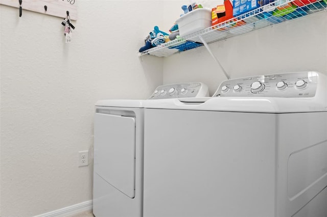 10820 Tarflower Dr Unit 202, Venice, FL 34293 - washroom with independent washer and dryer and baseboards