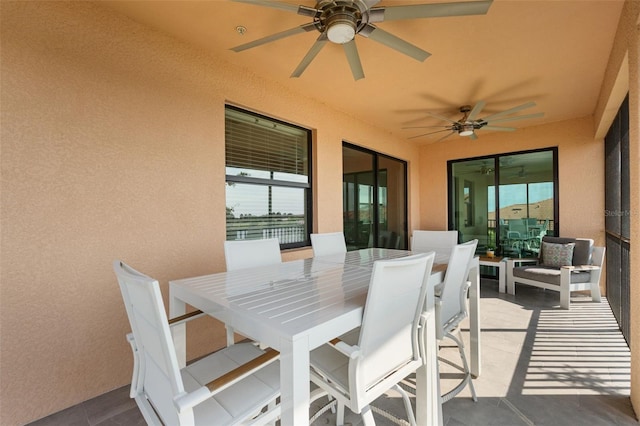 10820 Tarflower Dr Unit 202, Venice, FL 34293 - view of patio / terrace featuring a ceiling fan and outdoor dining area