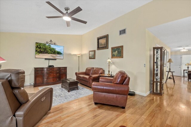 6207 Courtside Dr Unit 23, Bradenton, FL 34210 - living area featuring a ceiling fan, light wood finished floors, and baseboards