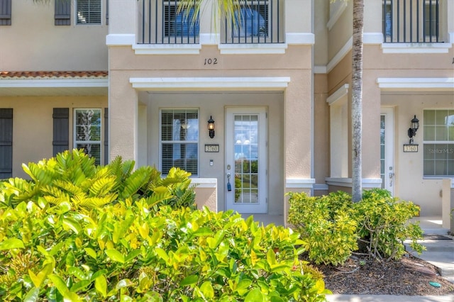 3760 82nd Avenue Cir E Unit 102, Sarasota, FL 34243 - entrance to property featuring stucco siding