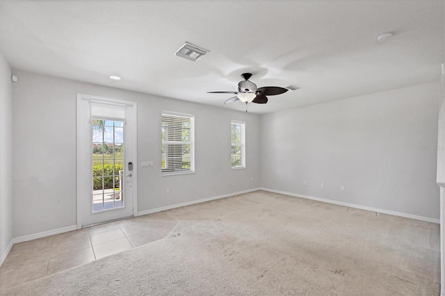3760 82nd Avenue Cir E Unit 102, Sarasota, FL 34243 - carpeted empty room with baseboards, ceiling fan, and tile patterned floors