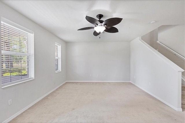 3760 82nd Avenue Cir E Unit 102, Sarasota, FL 34243 - empty room featuring light colored carpet, a ceiling fan, and baseboards