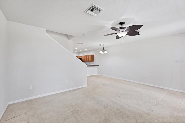 3760 82nd Avenue Cir E Unit 102, Sarasota, FL 34243 - unfurnished living room with ceiling fan, baseboards, light colored carpet, and recessed lighting