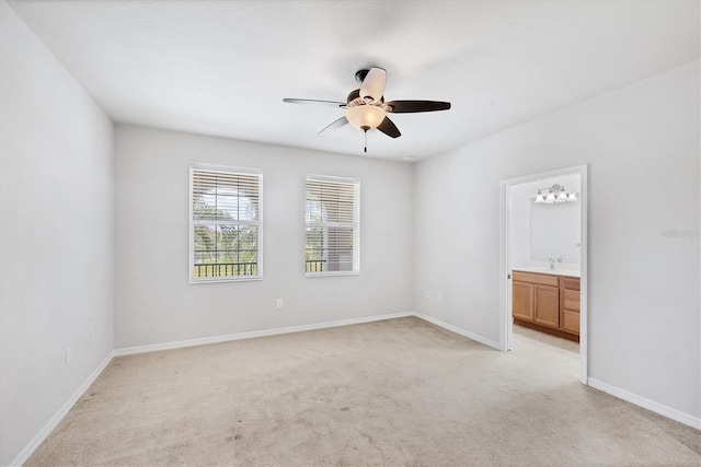 3760 82nd Avenue Cir E Unit 102, Sarasota, FL 34243 - empty room featuring ceiling fan, light colored carpet, and baseboards