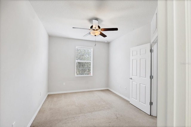 3760 82nd Avenue Cir E Unit 102, Sarasota, FL 34243 - empty room featuring a ceiling fan, light carpet, and baseboards