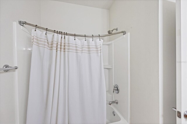 3760 82nd Avenue Cir E Unit 102, Sarasota, FL 34243 - bathroom featuring shower / bath combination with curtain