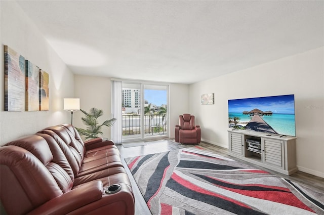 101 S Gulfstream Ave Unit 6C, Sarasota, FL 34236 - living area featuring wood finished floors and baseboards