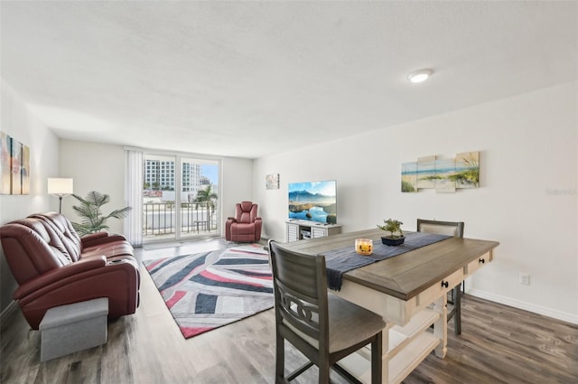 101 S Gulfstream Ave Unit 6C, Sarasota, FL 34236 - dining space with wood finished floors and baseboards