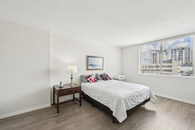 101 S Gulfstream Ave Unit 6C, Sarasota, FL 34236 - bedroom with wood finished floors and baseboards