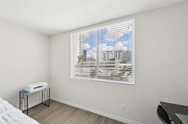 101 S Gulfstream Ave Unit 6C, Sarasota, FL 34236 - bedroom featuring wood finished floors and baseboards
