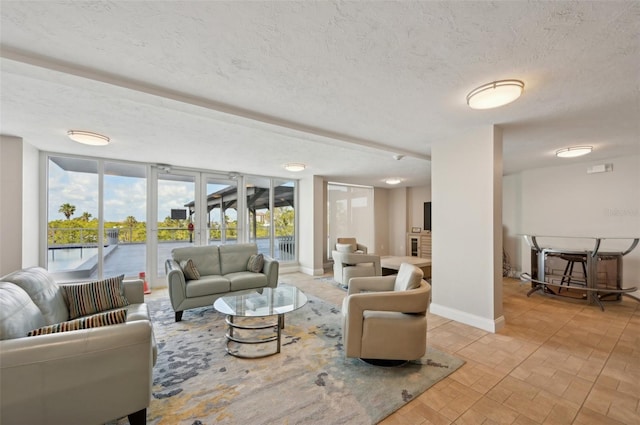 101 S Gulfstream Ave Unit 6C, Sarasota, FL 34236 - living area featuring baseboards, a textured ceiling, and brick patterned floors