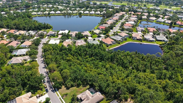 4920 Woodhurst Dr, Sarasota, FL 34243 - aerial perspective of suburban area with a large body of water