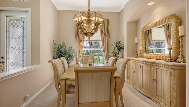 4920 Woodhurst Dr, Sarasota, FL 34243 - dining space featuring a chandelier, light carpet, and baseboards