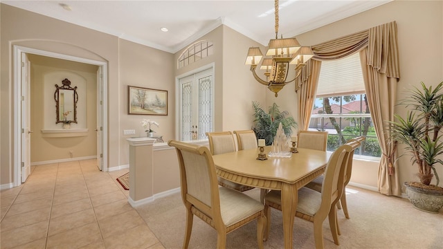 4920 Woodhurst Dr, Sarasota, FL 34243 - dining area featuring a chandelier, baseboards, crown molding, and light tile patterned floors