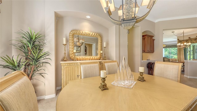 4920 Woodhurst Dr, Sarasota, FL 34243 - dining area with a chandelier, baseboards, crown molding, light carpet, and arched walkways