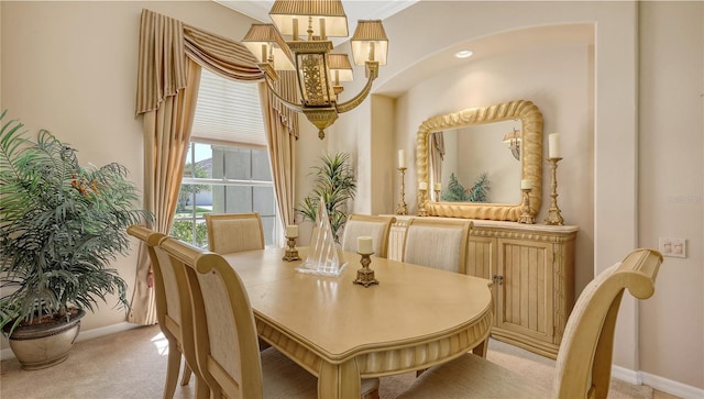 4920 Woodhurst Dr, Sarasota, FL 34243 - dining space with light carpet, baseboards, arched walkways, and a chandelier