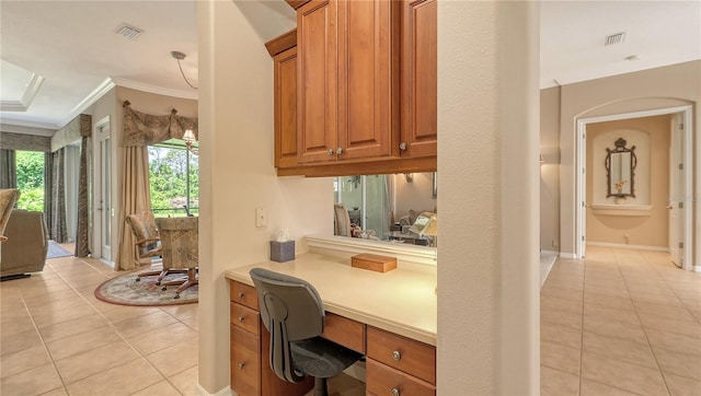 4920 Woodhurst Dr, Sarasota, FL 34243 - bar with light tile patterned floors, built in study area, and crown molding