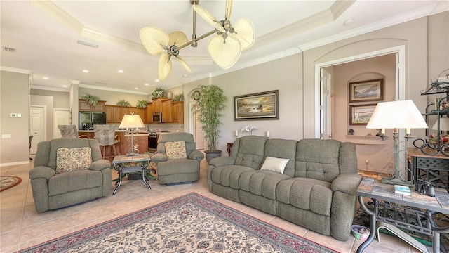 4920 Woodhurst Dr, Sarasota, FL 34243 - living area featuring light tile patterned flooring, ceiling fan, crown molding, a tray ceiling, and recessed lighting