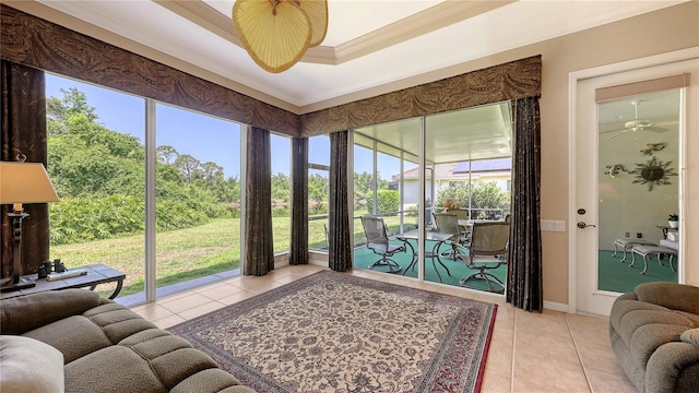 4920 Woodhurst Dr, Sarasota, FL 34243 - tiled living room with ceiling fan, crown molding, baseboards, and a tray ceiling