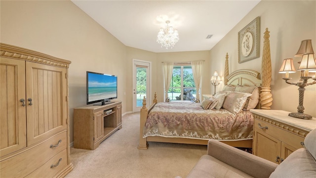 4920 Woodhurst Dr, Sarasota, FL 34243 - bedroom featuring access to exterior, light carpet, and a chandelier