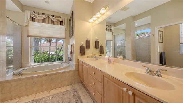 4920 Woodhurst Dr, Sarasota, FL 34243 - full bath with tile patterned floors, a bath, double vanity, and a tile shower