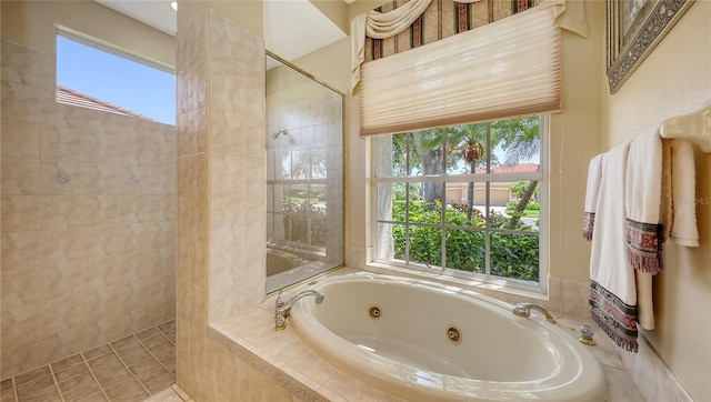 4920 Woodhurst Dr, Sarasota, FL 34243 - full bathroom with a tub with jets, a walk in shower, and healthy amount of natural light