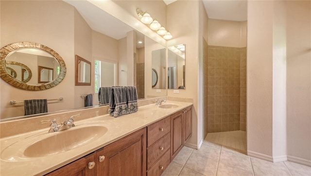 4920 Woodhurst Dr, Sarasota, FL 34243 - full bathroom with tile patterned flooring, baseboards, double vanity, and a walk in shower