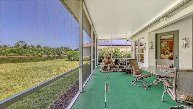 4920 Woodhurst Dr, Sarasota, FL 34243 - sunroom / solarium featuring a water view