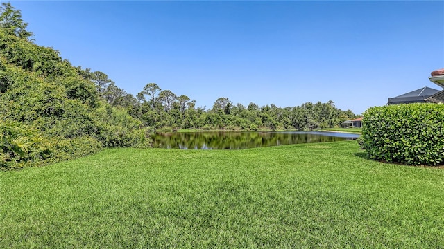 4920 Woodhurst Dr, Sarasota, FL 34243 - view of grassy yard with a water view