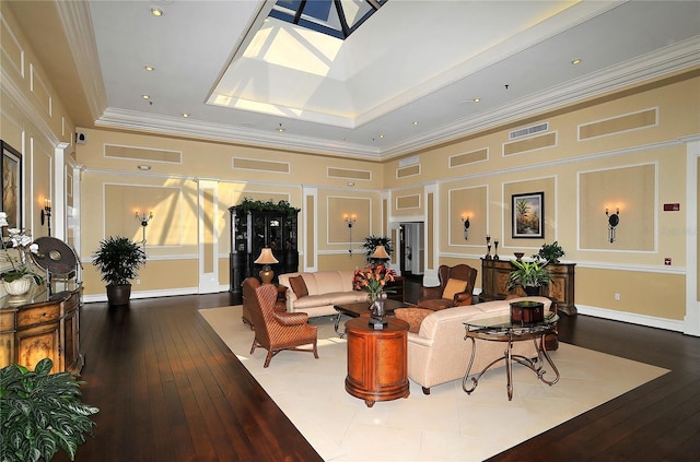 4920 Woodhurst Dr, Sarasota, FL 34243 - living area featuring a decorative wall, hardwood / wood-style flooring, and crown molding