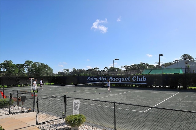 4920 Woodhurst Dr, Sarasota, FL 34243 - view of tennis court featuring fence