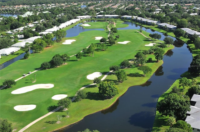 4920 Woodhurst Dr, Sarasota, FL 34243 - aerial perspective of suburban area with a golf course, a tree filled landscape, and a large body of water
